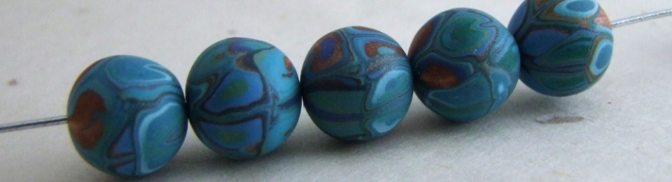 Aqua and copper patchwork beads by Cate van Alphen