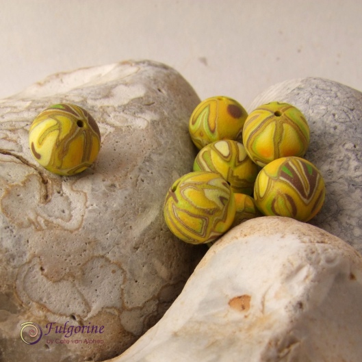 Yellow patchwork polymer clay beads by Cate van Alphen